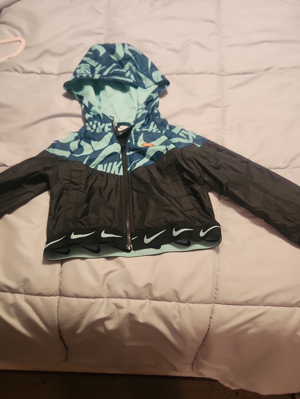 Nike Kids Black and Teal Hooded Rain Jacket with Swoosh Trim